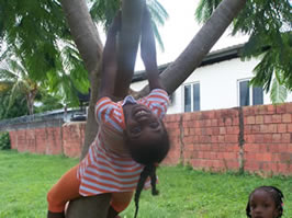 Climbing a tree at the Aranguez Savannah