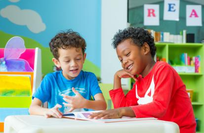 PEDIC - two boys sharing a book.jpeg