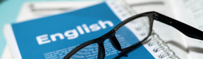 An English language textbook placed on a desk, symbolising the BA English Language and Literature with Education curriculum.