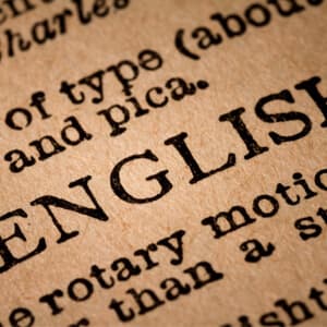 A close-up of the word English in a dictionary.