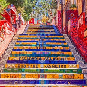 A vibrant button depicting the colourful stairs of Santiago de los Santos, representing the Portuguese program.
