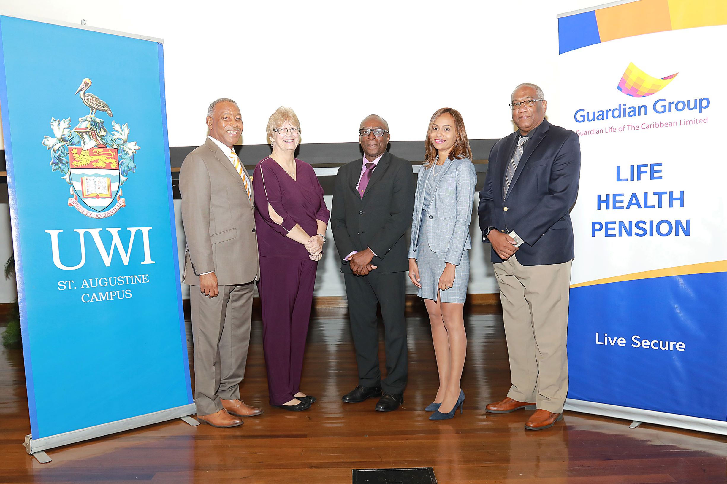 [L-R] Mr. Keston Nancoo, Advisor, Guardian Life of the Caribbean Ltd; Dr Margo Burns, Director, The UWI St. Augustine Campus Centre for Excellence in Teaching and Learning; Professor Wendel Abel, Professor of Mental Health Policy and Head of the Department of Community Health and Psychiatry at the Faculty of Medical Sciences, The UWI Mona Campus; Ms. Samanta Saugh, Vice President of Finance, Guardian Life of the Caribbean Ltd; and Pro Vice-Chancellor and Campus Principal of The UWI St. Augustine Professor Brian Copeland at The UWI/Guardian Group Premium Open Lecture.