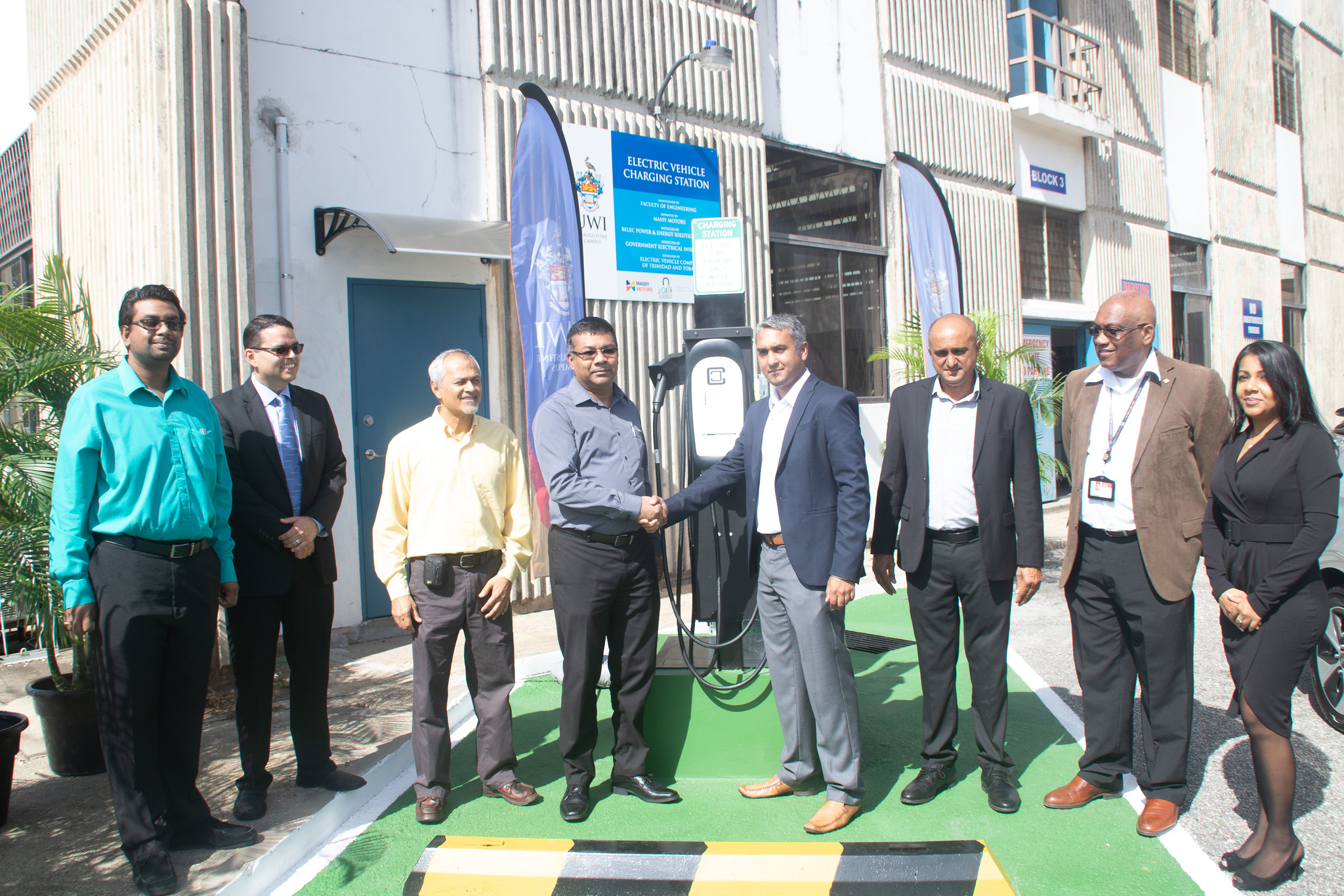 ey stakeholders greet each other at the launch of The UWI St. Augustine Campus’ first electric vehicle charging station:  Mr. Kevin Baboolal, Deputy Chief Electrical Inspector, Government Electrical Inspectorate; Mr. Jeremy Pagee, Assistant Vice President, Structural Changes, Massy Motors; Professor Chandrabhan Sharma, Department of Electrical and Computer Engineering and Representative of the Electric Vehicle Company of Trinidad and Tobago; Mr. Winston Boodoo, Managing Director,  BELEC  Power and Energy Solutions Limited;  Dr Sanjay Bahadoorsingh, Deputy Dean, Enterprise Development and Outreach and Senior Lecturer in the Department of Electrical and Computer Engineering; Mr. Dhanraj Samlal, Property and Projects Manager at Massy Motors; Pro Vice-Chancellor and Campus Principal, The UWI St. Augustine Professor Brian Copeland; and Ms. Tabitha Gopaul, General Manager, BELEC  Power and Energy Solutions Limited.