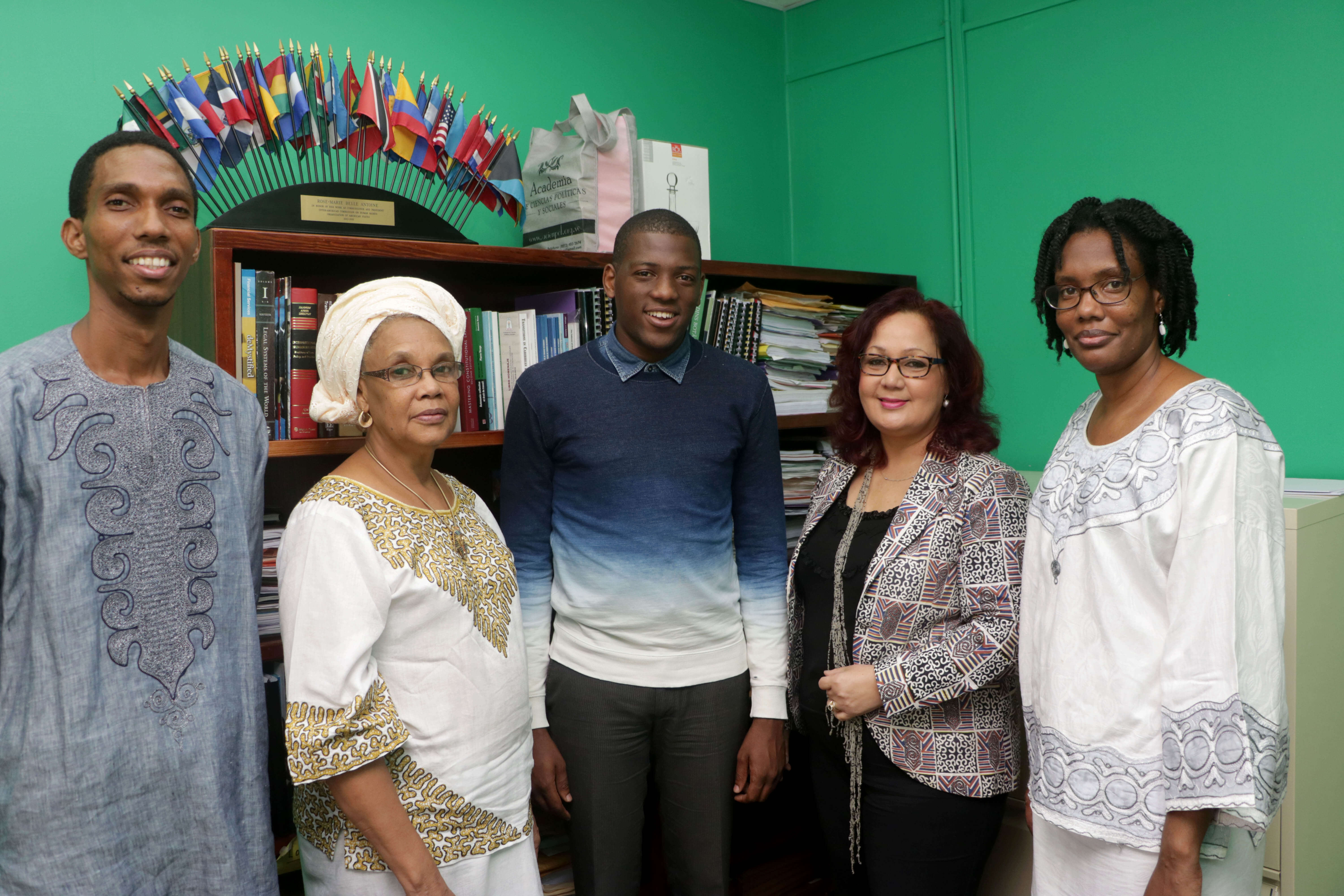 The family of Makandal Daaga: from left, Akhenaton Daaga, his mother Liseli and sister, Karomana, at right, with Kareem Marcelle, scholarship winner, and Professor Rose-Marie Belle-Antoine, Dean of the Faculty of Law